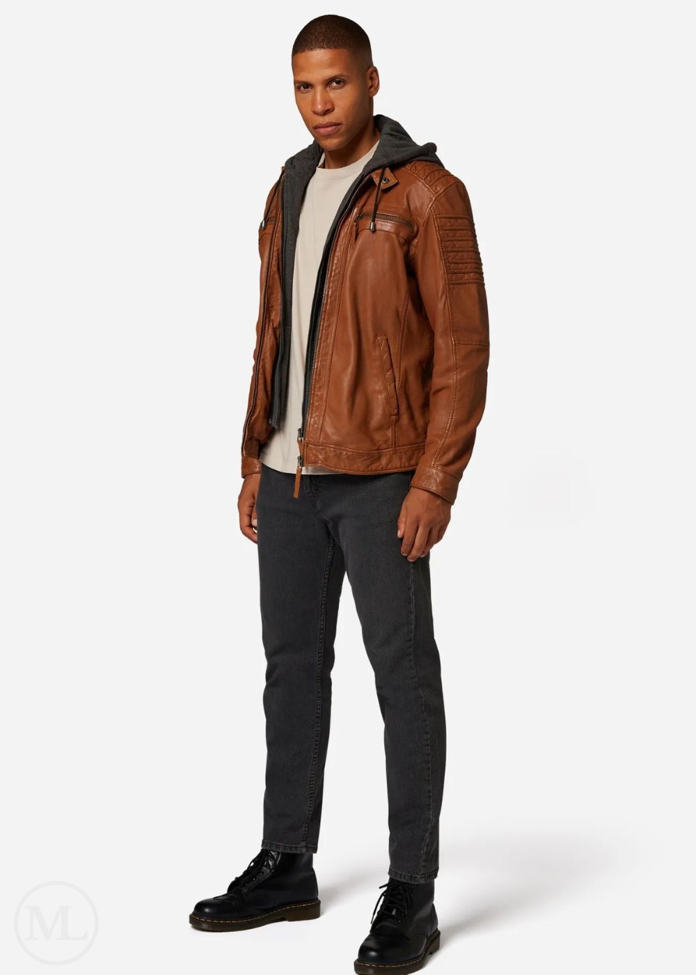 Man wearing a cognac brown leather jacket on a white background