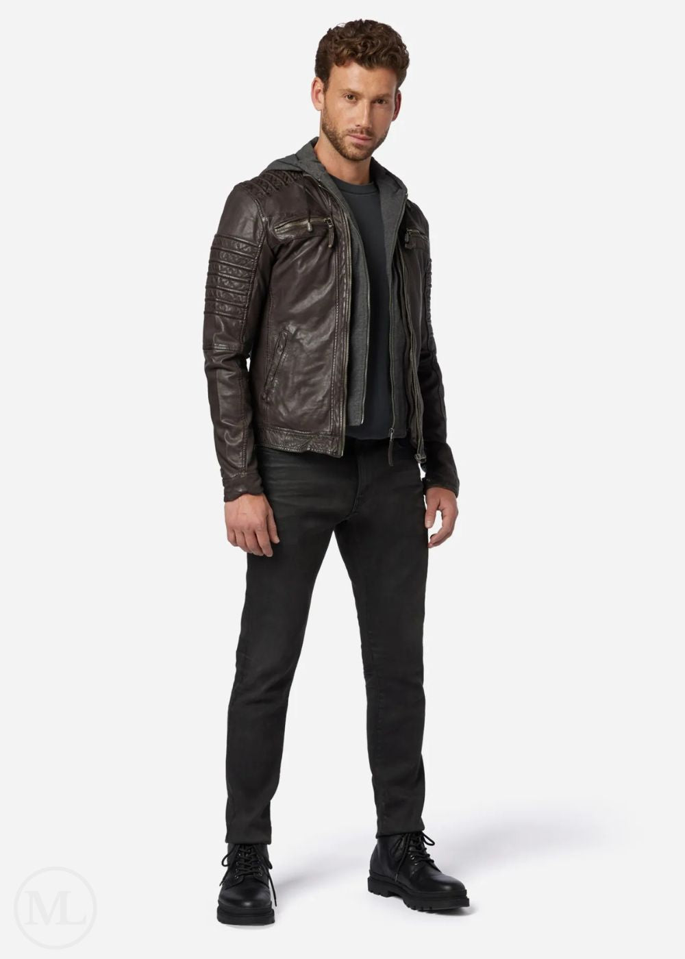 Man wearing a dark brown leather jacket and black pants on a white background