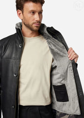 Man wearing a black leather coat with gray lining on a white background