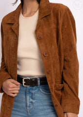 Cognac Brown suede leather coat worn over a cream sweater and blue jeans on a white background