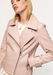 fuschia leather biker jacket worn by a women on a light gray background