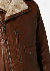 Cognac Brown leather jacket with fur lining worn by a man on a white background 