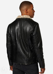 Man wearing a black leather jacket with white fur lining on a white background
