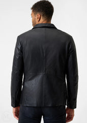 Man wearing a black leather blazer jacket on a white background