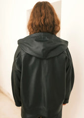 Women wearing a black Hoodie jacket against a white background