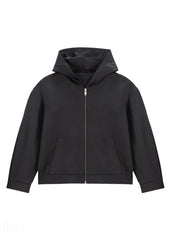 Women wearing a black Hoodie jacket against a white background