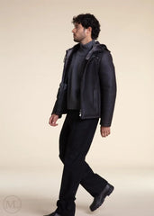 Man wearing a Dark Grey Hooded Shearling leather jacket and pants on a beige background