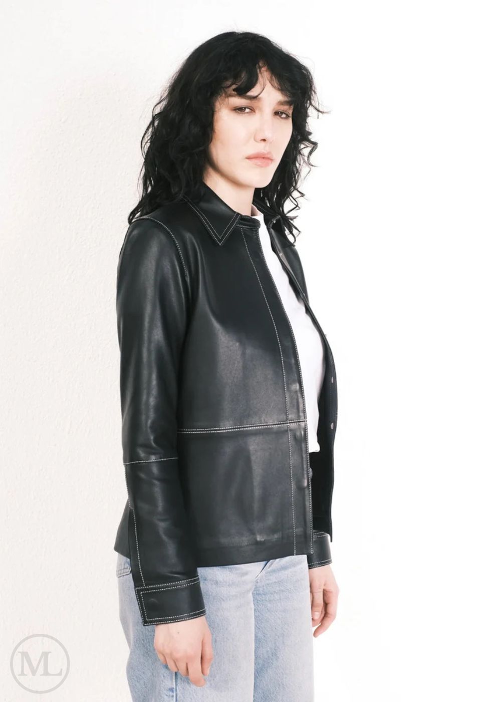 Women wearing a black leather jacket on a white background