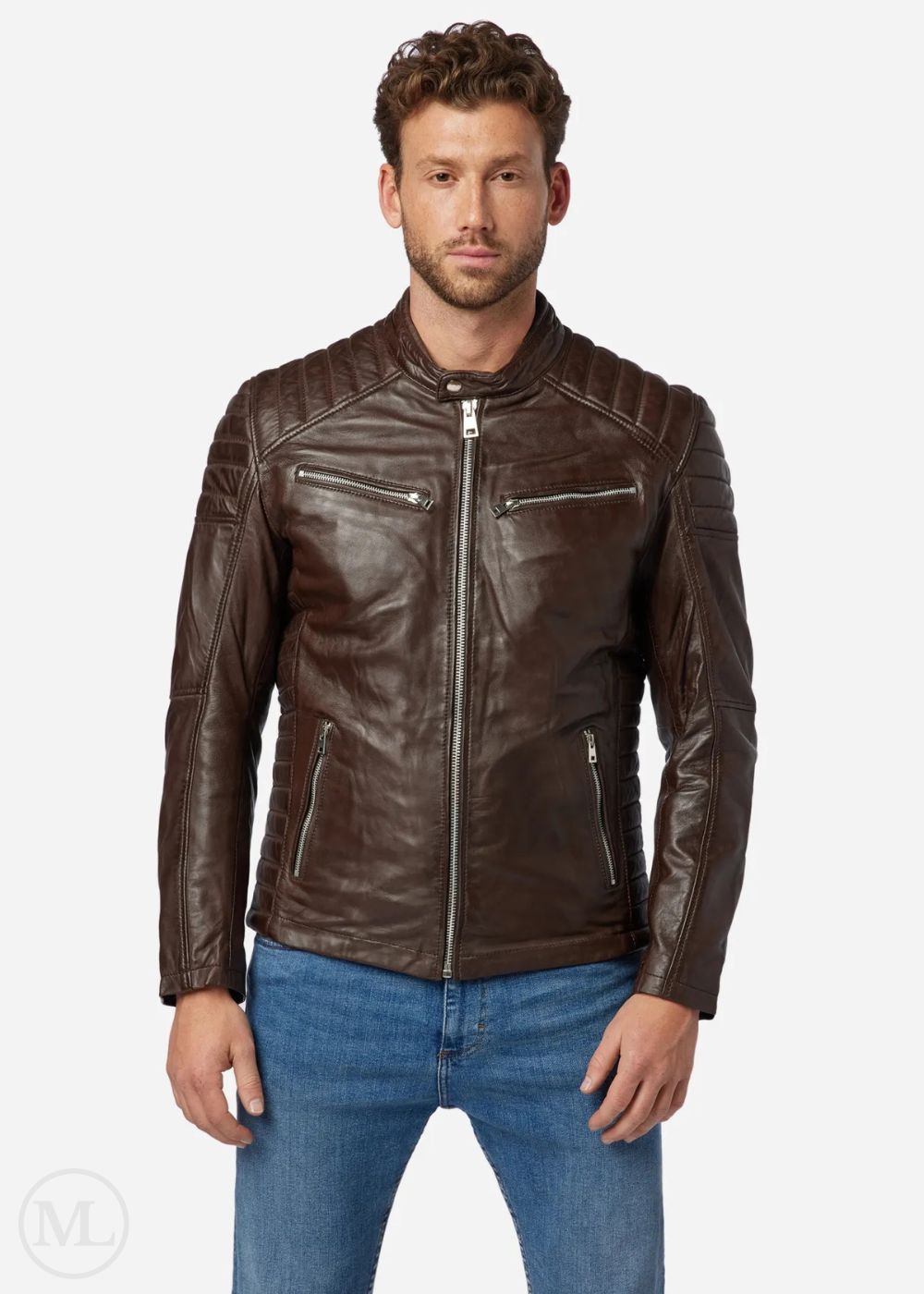 Man wearing a brown leather biker jacket and blue jeans on a white background